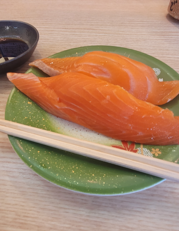 Delicious salmon sashimi nigiri at Mitsuriya Yamahana sushi in Sapporo, Japan.