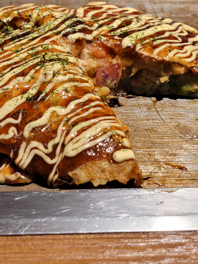 Delicious okonomiyaki in Dotonbori, Osaka.