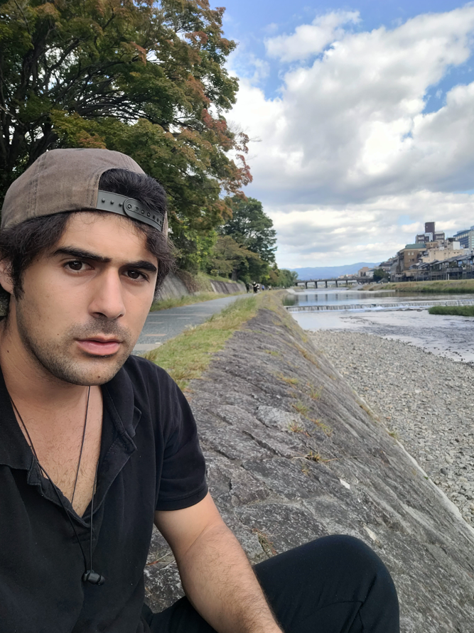 Taking a moment to rest at Kyoto's Kamo River.